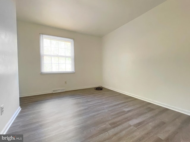 spare room featuring hardwood / wood-style flooring