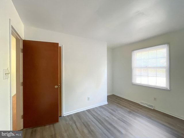 unfurnished room featuring light wood-type flooring