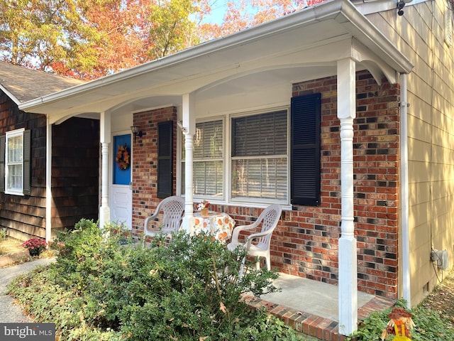 doorway to property with covered porch