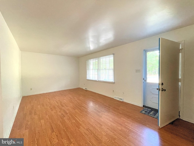 interior space with light hardwood / wood-style floors and plenty of natural light