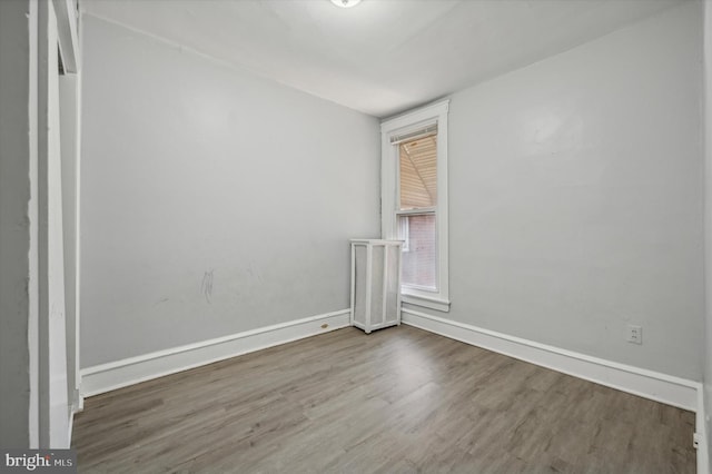 unfurnished room featuring hardwood / wood-style floors