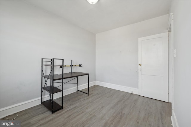 empty room with wood-type flooring