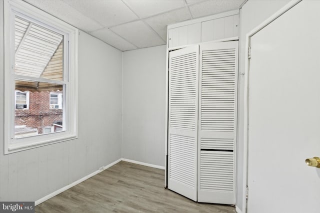 unfurnished bedroom with a closet and light hardwood / wood-style floors