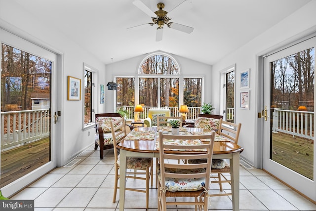 sunroom / solarium featuring lofted ceiling and ceiling fan