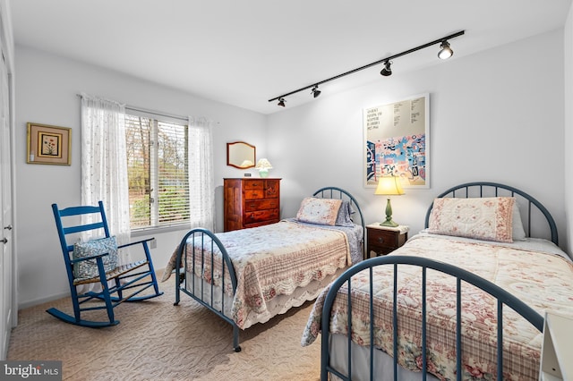 bedroom with carpet and baseboards