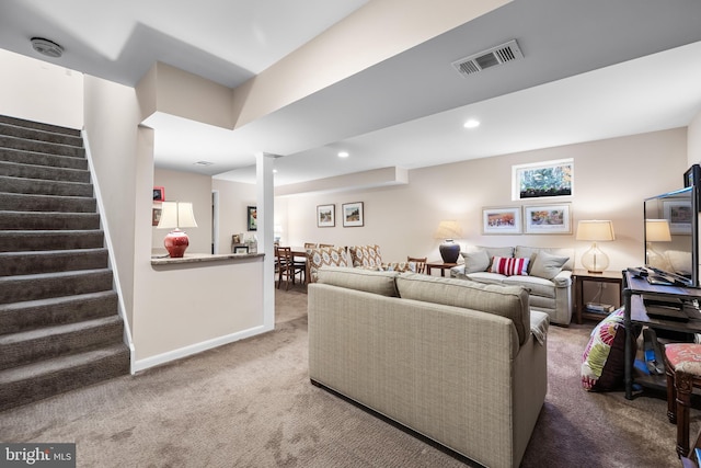 carpeted living room featuring stairway, baseboards, visible vents, and recessed lighting