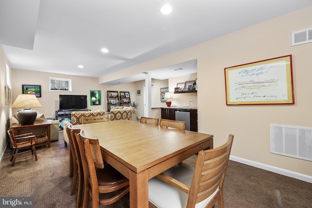 dining space with visible vents, dark colored carpet, indoor wet bar, and recessed lighting