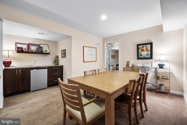 dining room with recessed lighting, visible vents, light carpet, and baseboards