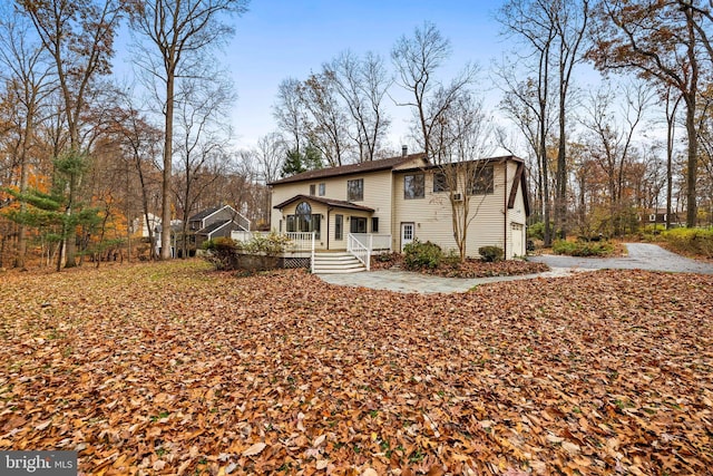 view of front of property featuring a garage and a deck