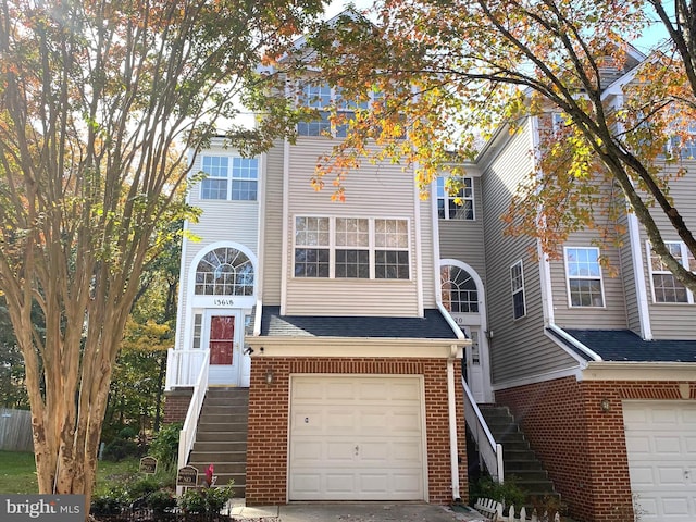 multi unit property featuring a garage