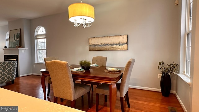 dining room featuring a chandelier and wood-type flooring