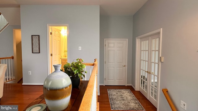 workout area featuring dark hardwood / wood-style flooring and french doors