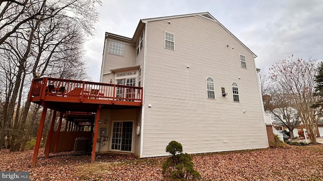 back of house with a deck