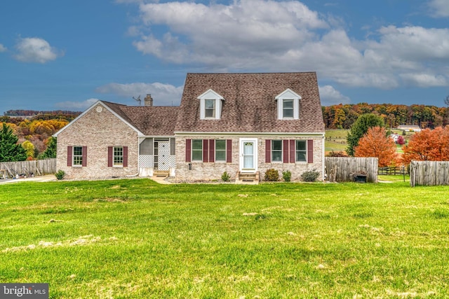 cape cod-style house featuring a front lawn