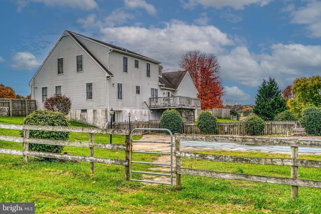 view of home's exterior with a lawn