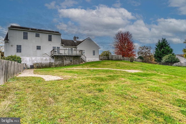 view of yard featuring a wooden deck