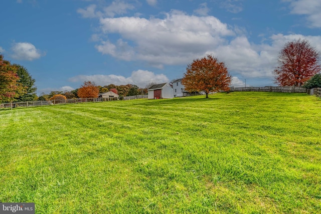 view of yard with a rural view