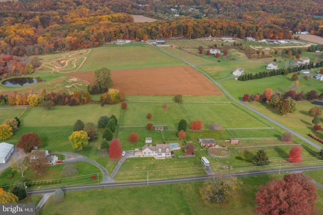 bird's eye view with a water view and a rural view