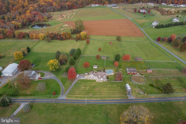 birds eye view of property with a rural view