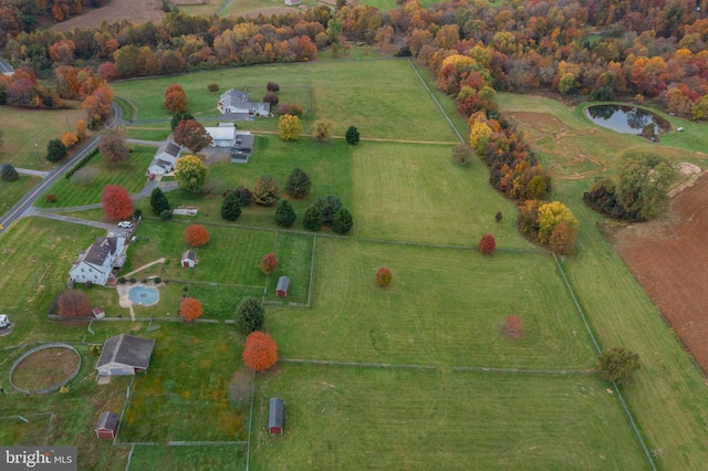 drone / aerial view featuring a rural view and a water view