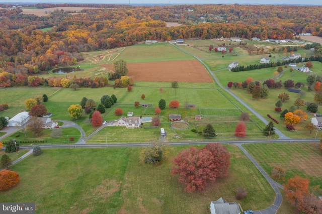 birds eye view of property with a rural view