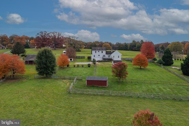 birds eye view of property with a rural view