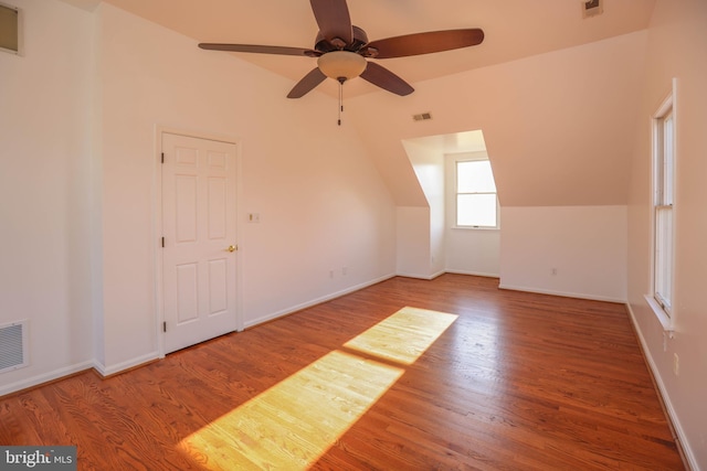 bonus room featuring hardwood / wood-style flooring, ceiling fan, and lofted ceiling