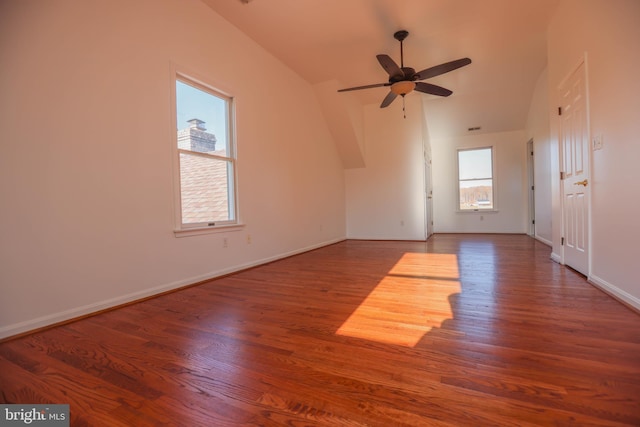 interior space with ceiling fan, vaulted ceiling, and hardwood / wood-style flooring