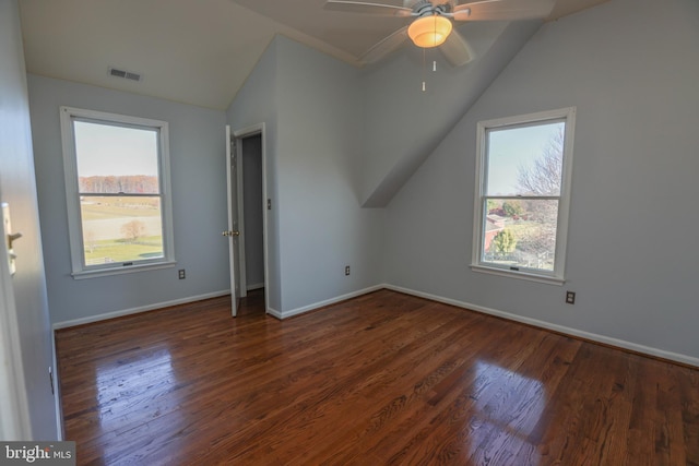 bonus room featuring dark hardwood / wood-style floors, a healthy amount of sunlight, ceiling fan, and vaulted ceiling