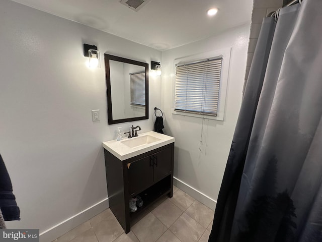 bathroom featuring tile patterned floors and vanity