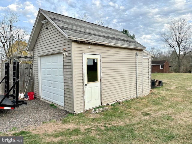 garage with a lawn