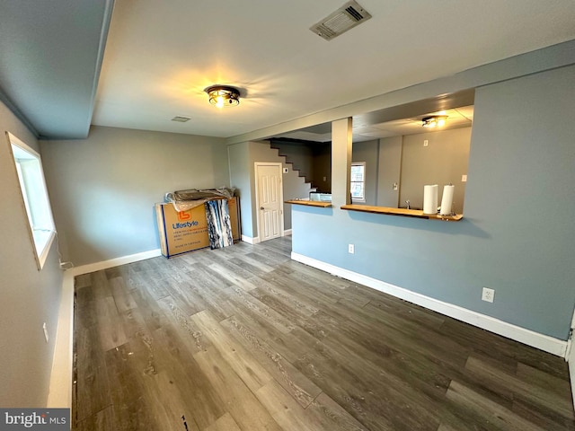 unfurnished living room featuring hardwood / wood-style floors