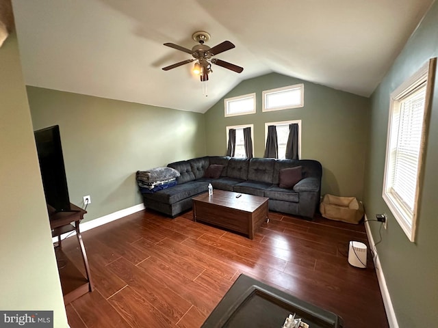 living room with ceiling fan, lofted ceiling, and dark wood-type flooring