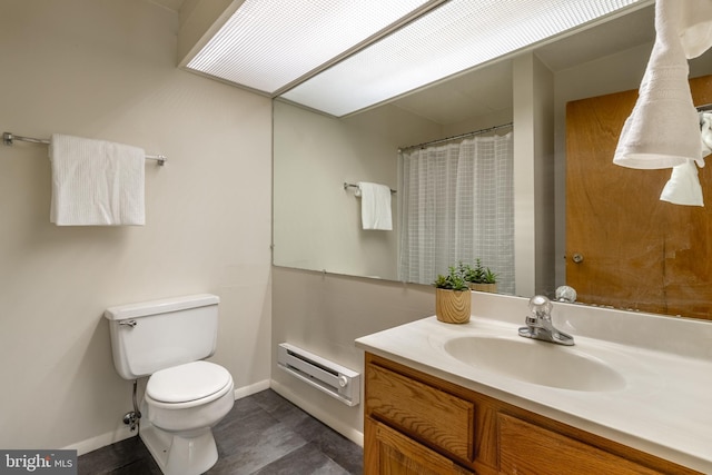 bathroom with vanity, a baseboard radiator, and toilet