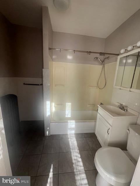 full bathroom featuring tile patterned flooring, bathtub / shower combination, vanity, and toilet