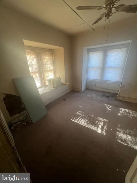 interior space featuring ceiling fan