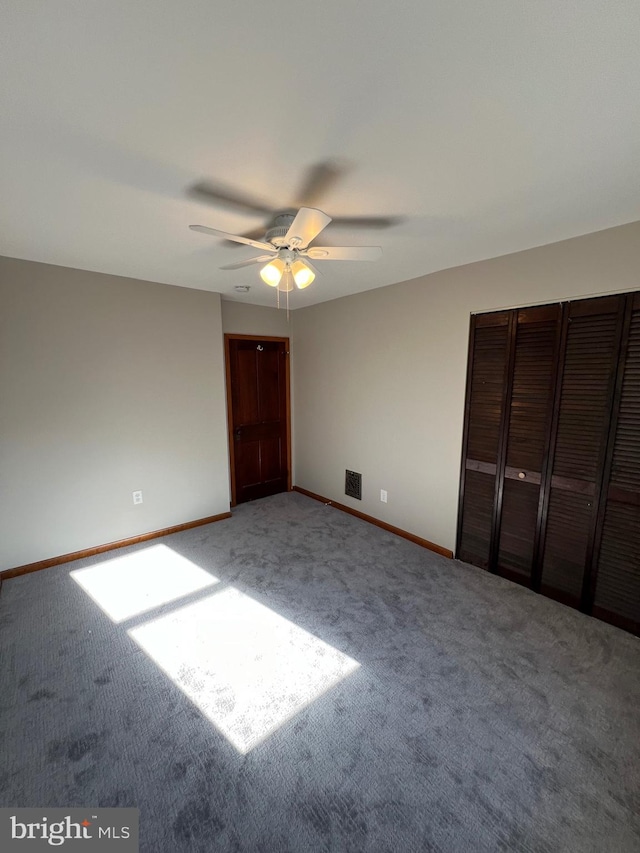 unfurnished bedroom with carpet flooring and ceiling fan