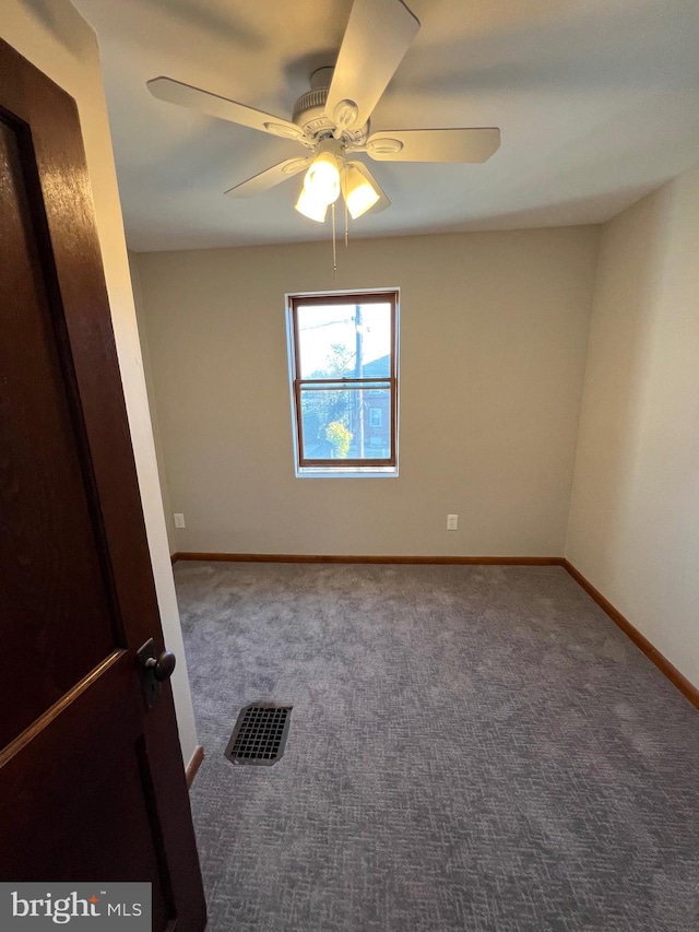 carpeted empty room with ceiling fan