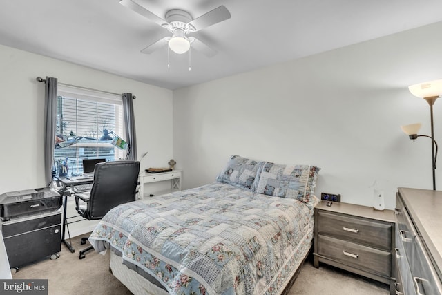 bedroom with light carpet and ceiling fan