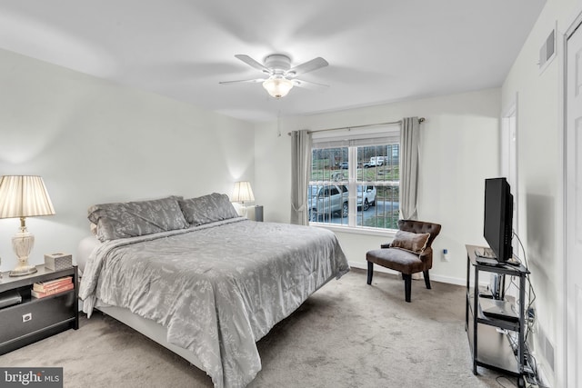 bedroom with light carpet and ceiling fan