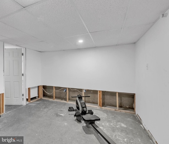 exercise room with a drop ceiling