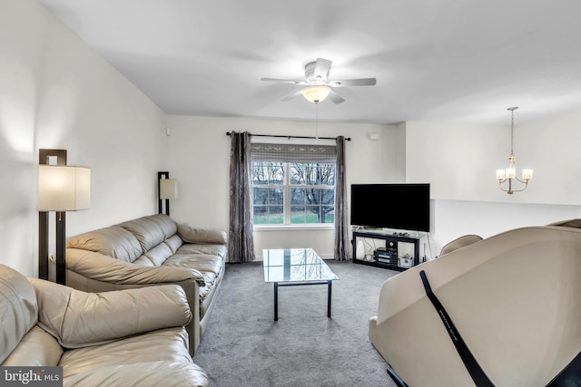 living room featuring ceiling fan with notable chandelier and light carpet