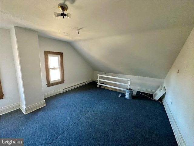 bonus room featuring a baseboard radiator, lofted ceiling, and dark colored carpet