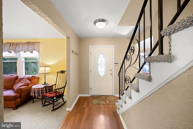 entrance foyer featuring hardwood / wood-style flooring