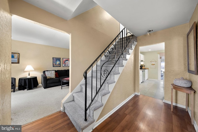 staircase with carpet flooring