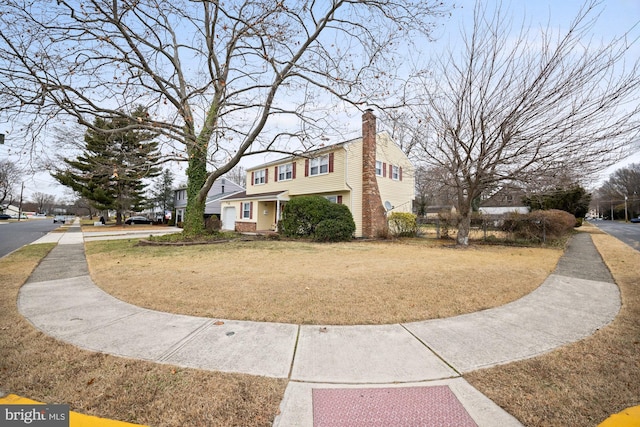 view of property exterior with a yard