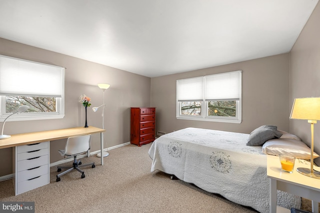 carpeted bedroom with a baseboard heating unit