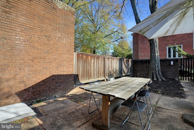 251 W Lafayette Ave, Baltimore, MD 21217 - fenced backyard with outdoor dining space and a patio