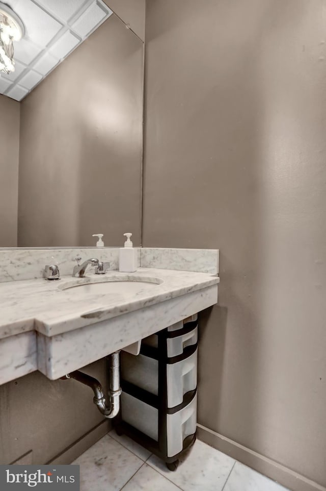 251 W Lafayette Ave, Baltimore, MD 21217 - bathroom featuring baseboards, tile patterned floors, and a sink