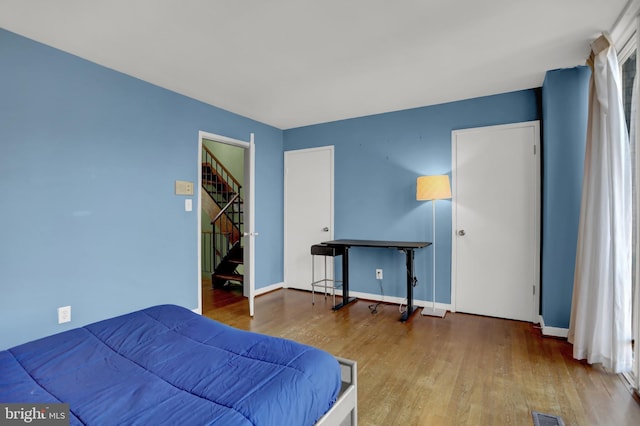251 W Lafayette Ave, Baltimore, MD 21217 - bedroom with wood finished floors and baseboards
